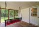 This porch features an outdoor swing and a screened exterior wall at 357 N Main St, Mount Pleasant, NC 28124