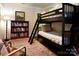 Bedroom with a bunk bed, a bookcase filled with books, and comfortable furnishings at 369 Skyland Ct, Mount Gilead, NC 27306