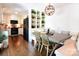 Bright dining area with built-in shelves, a modern light fixture, and views into the kitchen at 369 Skyland Ct, Mount Gilead, NC 27306