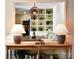 View through hall to dining area and built-in shelving with decorative plants at 369 Skyland Ct, Mount Gilead, NC 27306