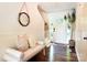 Bright foyer featuring hardwood floors, a cozy bench, and stylish decor at 369 Skyland Ct, Mount Gilead, NC 27306