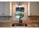 Bright kitchen window over stainless steel sink featuring an outdoor view at 369 Skyland Ct, Mount Gilead, NC 27306