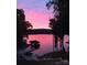 Picturesque view of the lake at sunset, showcasing the private dock and waterfront property at 369 Skyland Ct, Mount Gilead, NC 27306