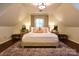 Cozy bedroom featuring a plush rug, symmetrical lighting, and neutral decor at 369 Skyland Ct, Mount Gilead, NC 27306