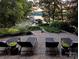 Serene patio with comfortable lounge chairs and breathtaking waterfront views at 369 Skyland Ct, Mount Gilead, NC 27306