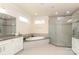 A stylish bathroom with a modern glass shower, a luxurious soaking tub, and elegant cabinetry at 398 Hampton Trail Dr # 97, Fort Mill, SC 29708