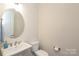 Bathroom features a toilet, single sink vanity, and ample lighting at 398 Hampton Trail Dr # 97, Fort Mill, SC 29708