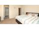 Comfortable bedroom features neutral walls and carpet, ensuite bathroom, and sunny windows at 398 Hampton Trail Dr # 97, Fort Mill, SC 29708