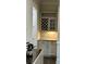 Butlers pantry with wine rack, glass door cabinets, stone backsplash, and gray cabinets at 398 Hampton Trail Dr # 97, Fort Mill, SC 29708