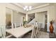 Spacious dining room with contemporary decor, a modern table, and an elegant chandelier at 398 Hampton Trail Dr # 97, Fort Mill, SC 29708