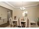 Elegant dining room with a modern chandelier, large dining table, and decorative accents at 398 Hampton Trail Dr # 97, Fort Mill, SC 29708