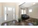 Bright entryway showcasing hardwood floors, a decorative glass door, and a cozy seating area at 398 Hampton Trail Dr # 97, Fort Mill, SC 29708