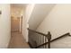 Bright hallway with staircase featuring a wood railing at 398 Hampton Trail Dr # 97, Fort Mill, SC 29708