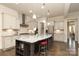 Spacious kitchen features a large island, stainless steel appliances, and elegant pendant lighting at 398 Hampton Trail Dr # 97, Fort Mill, SC 29708