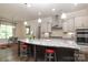 Bright kitchen showcasing a large island, custom cabinetry, and stainless steel appliances at 398 Hampton Trail Dr # 97, Fort Mill, SC 29708