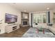 Spacious living room with stone fireplace, large screen television and oversized sofa at 398 Hampton Trail Dr # 97, Fort Mill, SC 29708