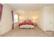 An inviting bedroom featuring bright windows, neutral paint, side tables and carpet flooring at 398 Hampton Trail Dr # 97, Fort Mill, SC 29708