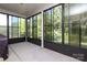Relaxing screened-in porch with views of the wooded backyard at 398 Hampton Trail Dr # 97, Fort Mill, SC 29708
