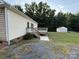 Charming backyard with a wooden deck, a shed, and lush greenery, creating a serene outdoor space at 40287 Palmerville Rd, New London, NC 28127