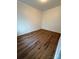 Clean and spacious bedroom with wood-look flooring and ample natural light, perfect for relaxation at 40287 Palmerville Rd, New London, NC 28127