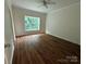 Bedroom featuring hardwood floors, crown molding, a ceiling fan, and large windows providing natural light at 40287 Palmerville Rd, New London, NC 28127