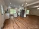 Modern kitchen featuring stainless steel appliances, marble countertops, a center island, and bright, natural light at 40287 Palmerville Rd, New London, NC 28127