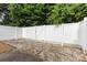 Backyard with a white vinyl fence and a small area covered in pea gravel at 409 Lexie Ln, Rock Hill, SC 29732