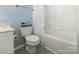 Full bathroom with a shower-tub, toilet and small vanity at 409 Lexie Ln, Rock Hill, SC 29732