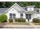 Charming home featuring a light exterior, well-maintained landscaping, and bright windows at 409 Lexie Ln, Rock Hill, SC 29732