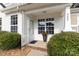 Inviting covered porch with a large window, brick-lined base, and a welcoming entryway at 409 Lexie Ln, Rock Hill, SC 29732
