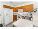 Functional kitchen features wooden cabinets, white appliances, and ample counter space at 409 Lexie Ln, Rock Hill, SC 29732