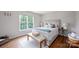 Inviting bedroom with natural light, stylish decor, and hardwood floors at 5005 Chestnut Knoll Ln, Charlotte, NC 28269
