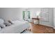 Serene bedroom with windows, desk, and wood floors at 5005 Chestnut Knoll Ln, Charlotte, NC 28269