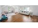 Bright bonus room features hardwood floors, large windows, and cozy furnishings at 5005 Chestnut Knoll Ln, Charlotte, NC 28269