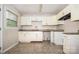 Bright kitchen featuring white cabinetry, modern countertops, and a stainless steel sink at 5143 Delivau Dr, Charlotte, NC 28215