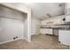 Spacious kitchen featuring white cabinets, granite countertops, tile flooring, and a pantry area at 5143 Delivau Dr, Charlotte, NC 28215