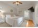 Cozy bedroom with a plush bed, neutral decor, and a large window for natural light at 515 N Main Gq St, Granite Quarry, NC 28146