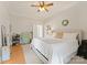 Bedroom with hardwood floors, neutral decor, and ample storage space for organization at 515 N Main Gq St, Granite Quarry, NC 28146