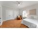 Comfortable bedroom featuring wood floors, built in closets, and lots of natural light from the window at 515 N Main Gq St, Granite Quarry, NC 28146