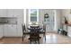Cozy breakfast nook with round table near bright window and kitchen cabinets at 515 N Main Gq St, Granite Quarry, NC 28146