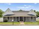Home exterior with long porch, walkway and healthy yard at 515 N Main Gq St, Granite Quarry, NC 28146