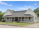 Well-maintained home with inviting porch, manicured lawn, and charming curb appeal at 515 N Main Gq St, Granite Quarry, NC 28146