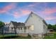 Charming house exterior with a quaint front porch and fenced yard at 515 N Main Gq St, Granite Quarry, NC 28146