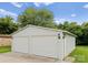 Spacious two-car garage with additional storage and side entrance at 515 N Main Gq St, Granite Quarry, NC 28146