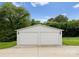 Detached two-car garage with ample parking space and landscaping at 515 N Main Gq St, Granite Quarry, NC 28146