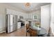 Bright kitchen boasts stainless steel appliances and a cozy breakfast nook with a round table at 515 N Main Gq St, Granite Quarry, NC 28146