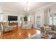 Elegant living room with hardwood floors, stylish furniture, and a view of the next room at 515 N Main Gq St, Granite Quarry, NC 28146