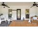 Cozy front porch with rocking chairs, ceiling fans, and a welcoming entrance at 515 N Main Gq St, Granite Quarry, NC 28146