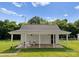 Charming shed featuring a covered porch area with seating and view of a backyard at 515 N Main Gq St, Granite Quarry, NC 28146