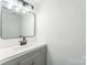 Bathroom featuring light vanity with framed mirror at 5226 Fair Wind Ln, Charlotte, NC 28212